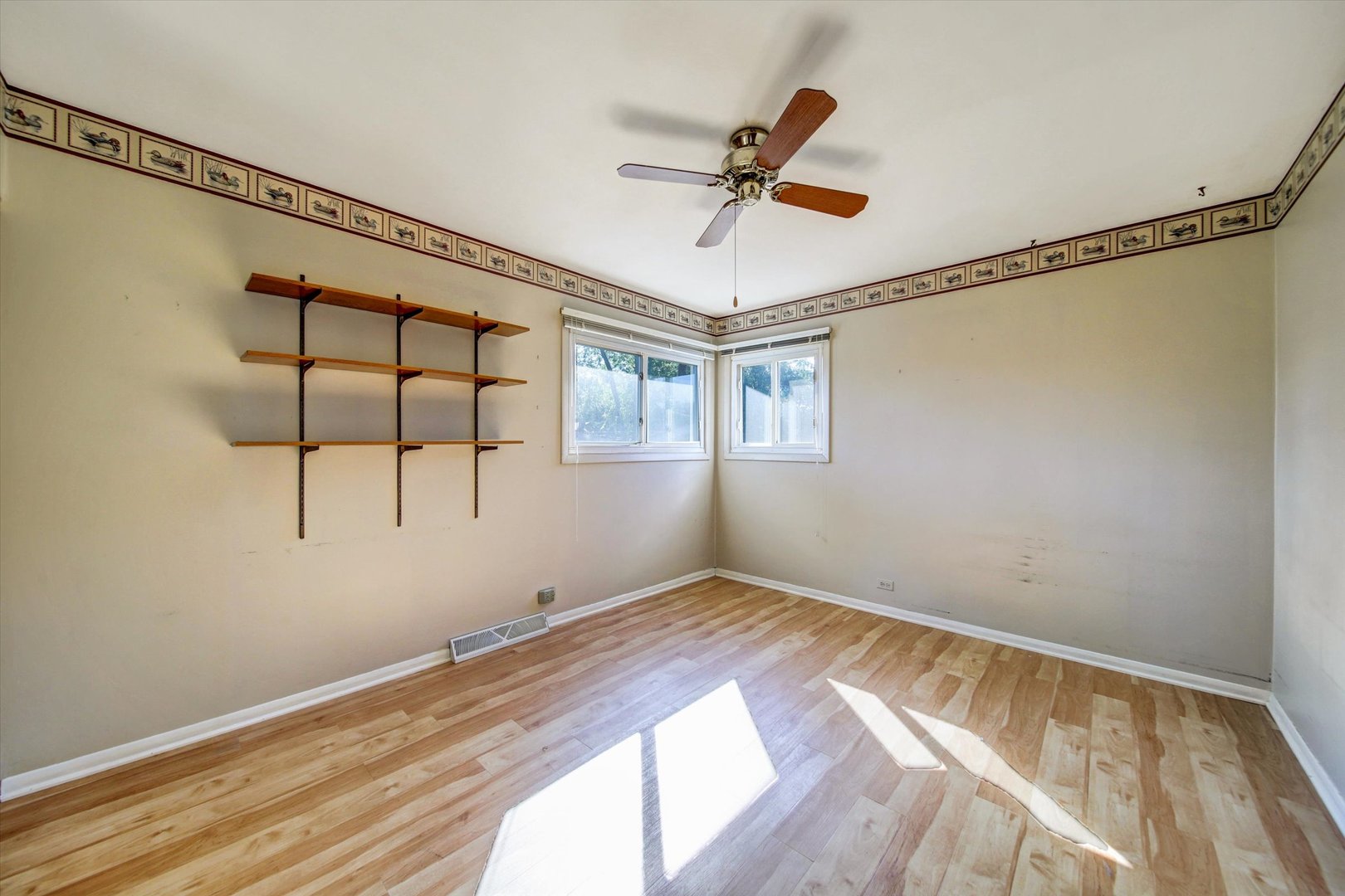445 South Yale Avenue Addison, IL 60101 - Photo 8 of 20 a view of empty room with wooden floor and fan