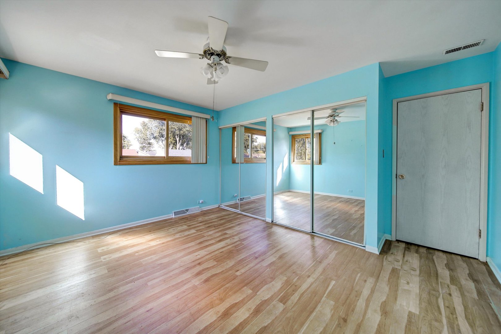 445 South Yale Avenue Addison, IL 60101 - Photo 10 of 20 a view of empty room with wooden floor and fan