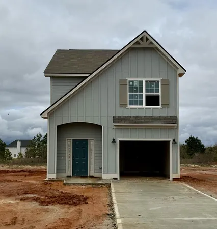a front view of a house with yard
