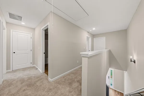 a bathroom with a sink a toilet and a large mirror