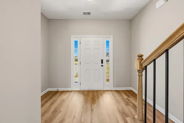 a view of a hallway with staircase