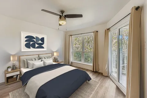 a bedroom with a bed and a television in it