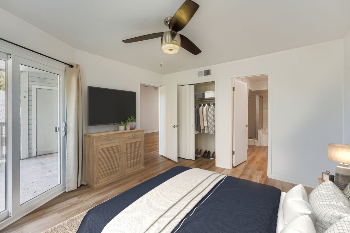 2450 Wickersham Lane, Unit 604 Austin, TX 78741 - Photo 13 of 22 a bedroom with a bed and a television in it