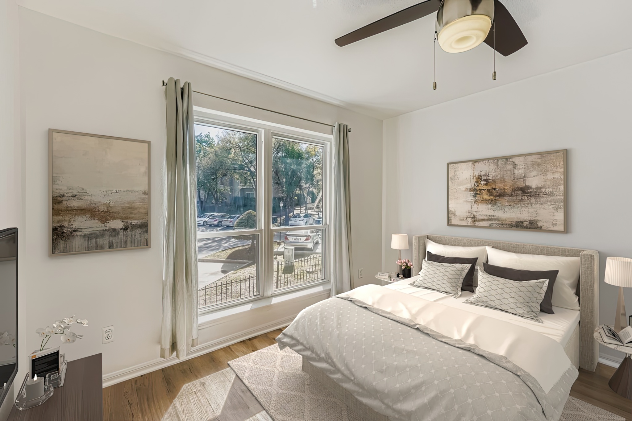 2450 Wickersham Lane, Unit 604 Austin, TX 78741 - Photo 17 of 22 a bedroom with a large bed and a large window