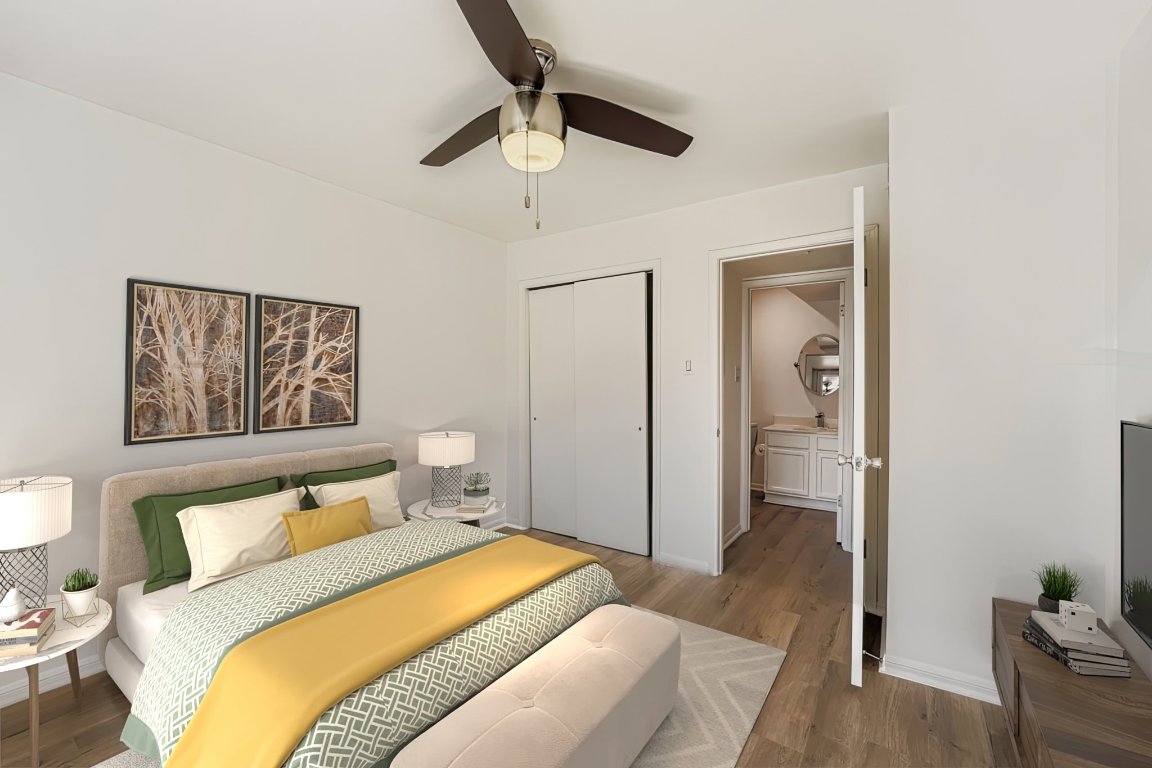 2450 Wickersham Lane, Unit 604 Austin, TX 78741 - Photo 18 of 22 a bedroom with a bed and a painting on the wall