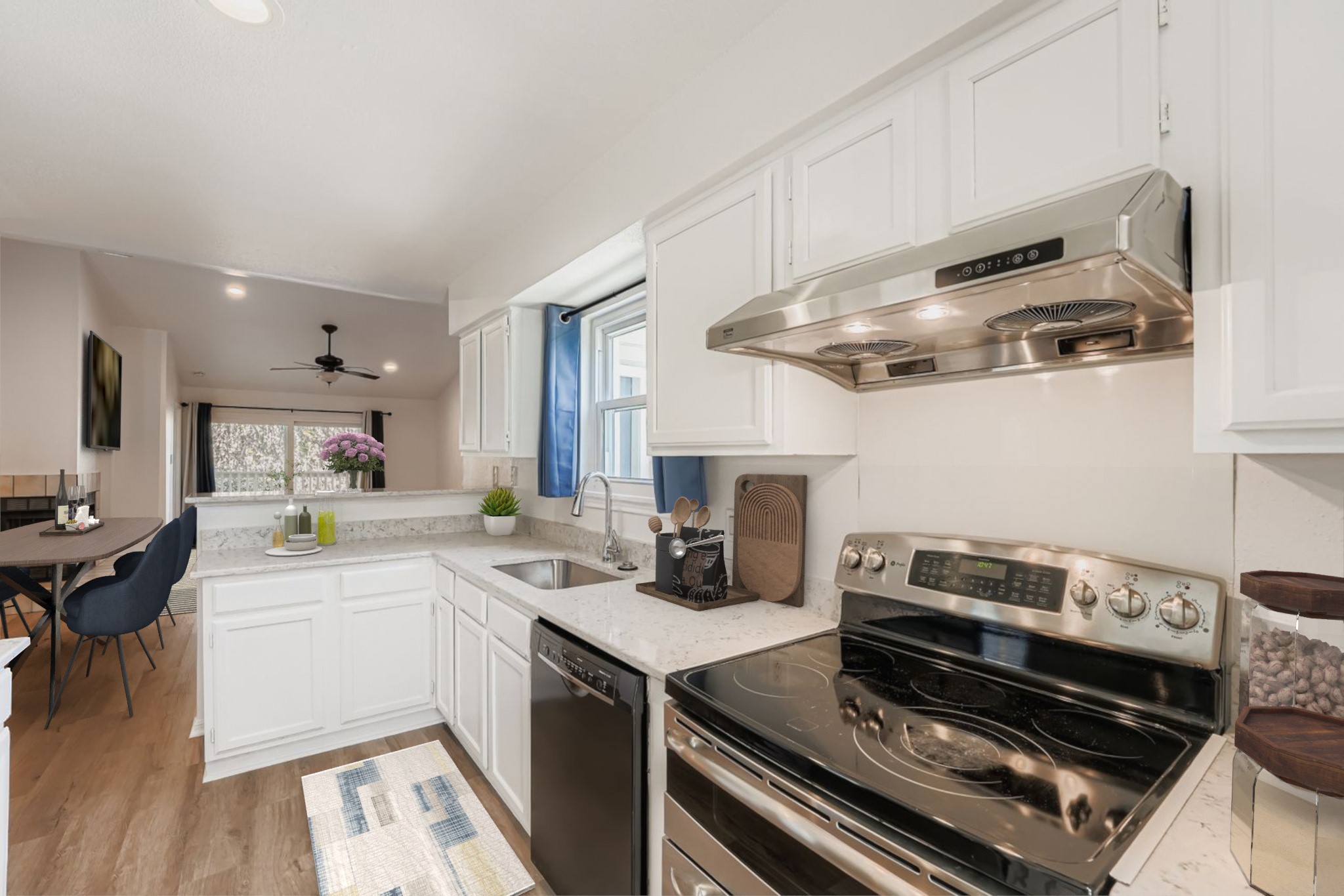 2450 Wickersham Lane, Unit 604 Austin, TX 78741 - Photo 6 of 22 a kitchen with a stove and a sink