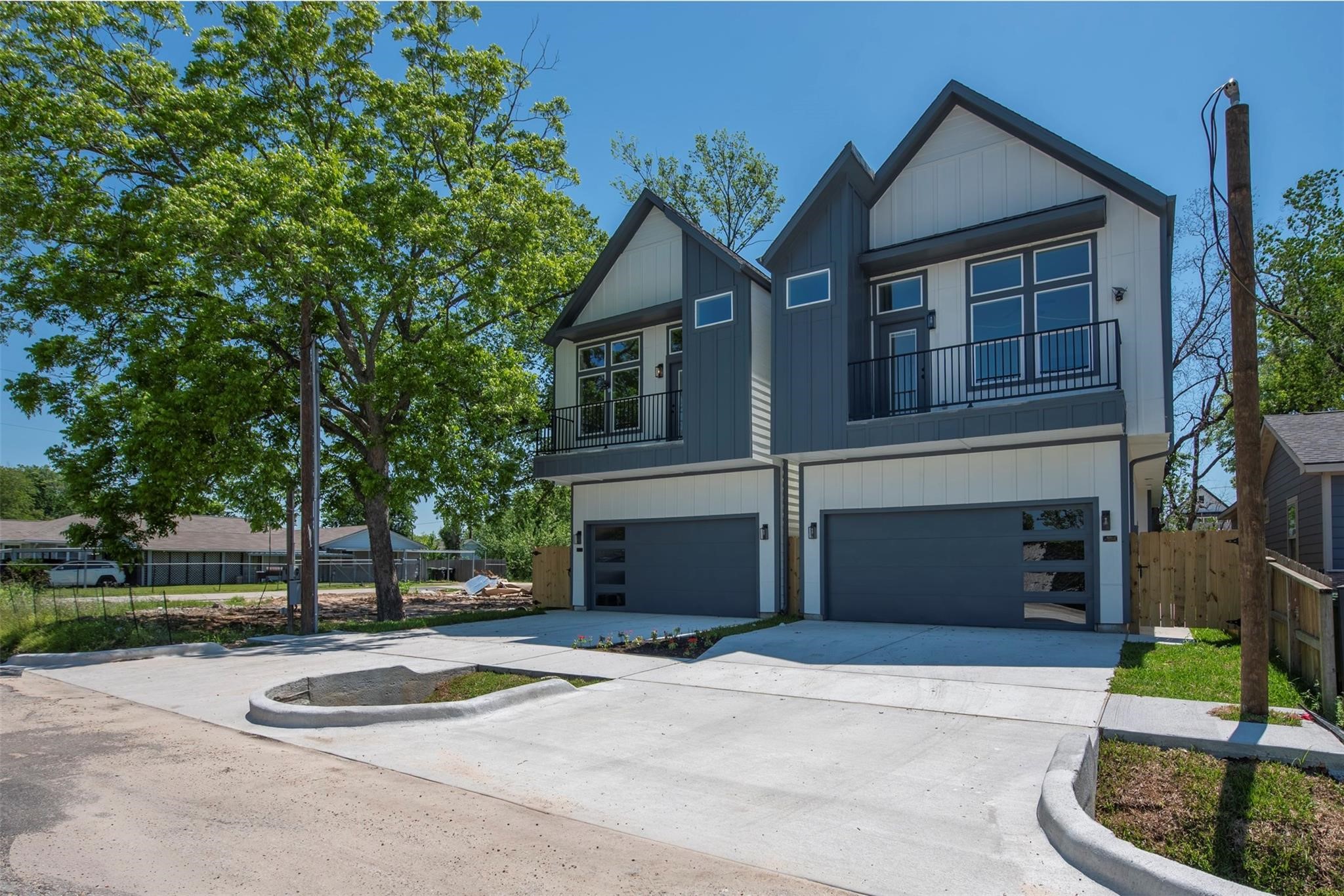 Front elevation of the homes offer symmetrical design, dual-toned siding, upper-level balconies, and a contemporary finish.