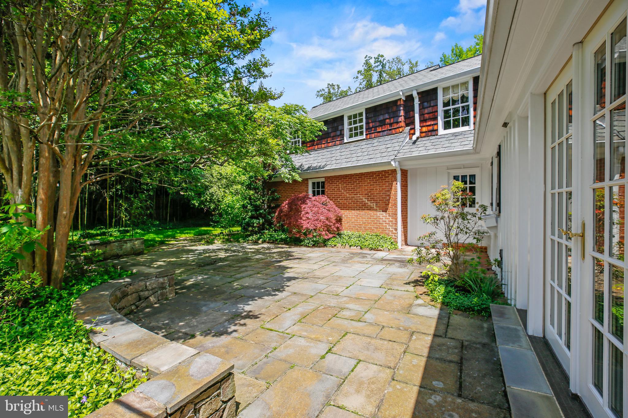 7125 Darby Road Bethesda, MD 20817 - Photo 13 of 64 a front view of a house with garden