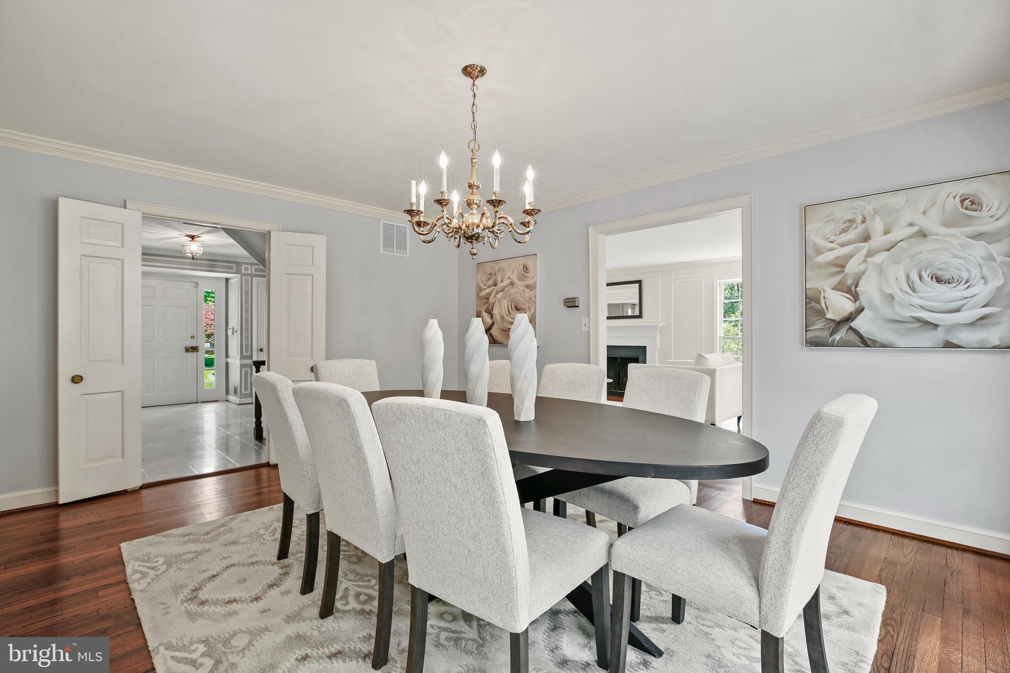 7125 Darby Road Bethesda, MD 20817 - Photo 19 of 64 a view of a dining room with furniture and wooden floor
