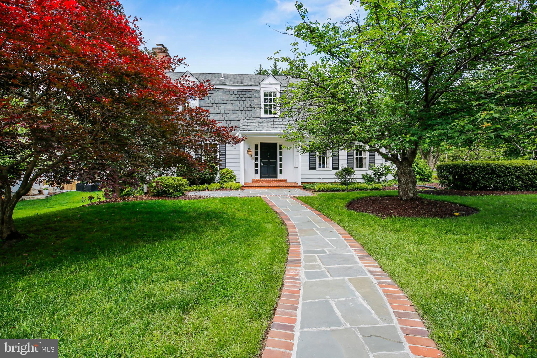 7125 Darby Road Bethesda, MD 20817 - Photo 2 of 64 a front view of a house with a yard