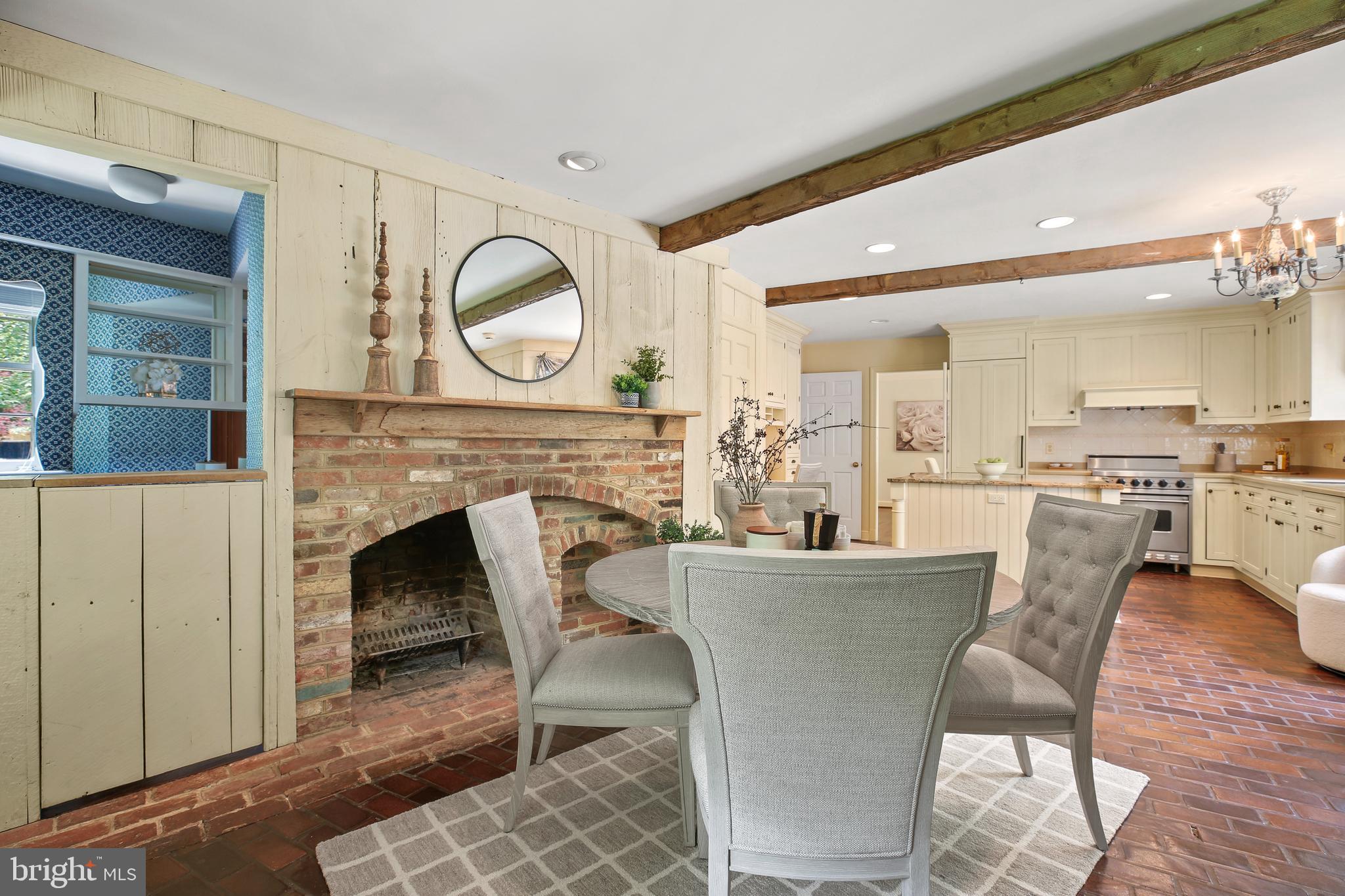 7125 Darby Road Bethesda, MD 20817 - Photo 26 of 64 a dining room with furniture and a fireplace