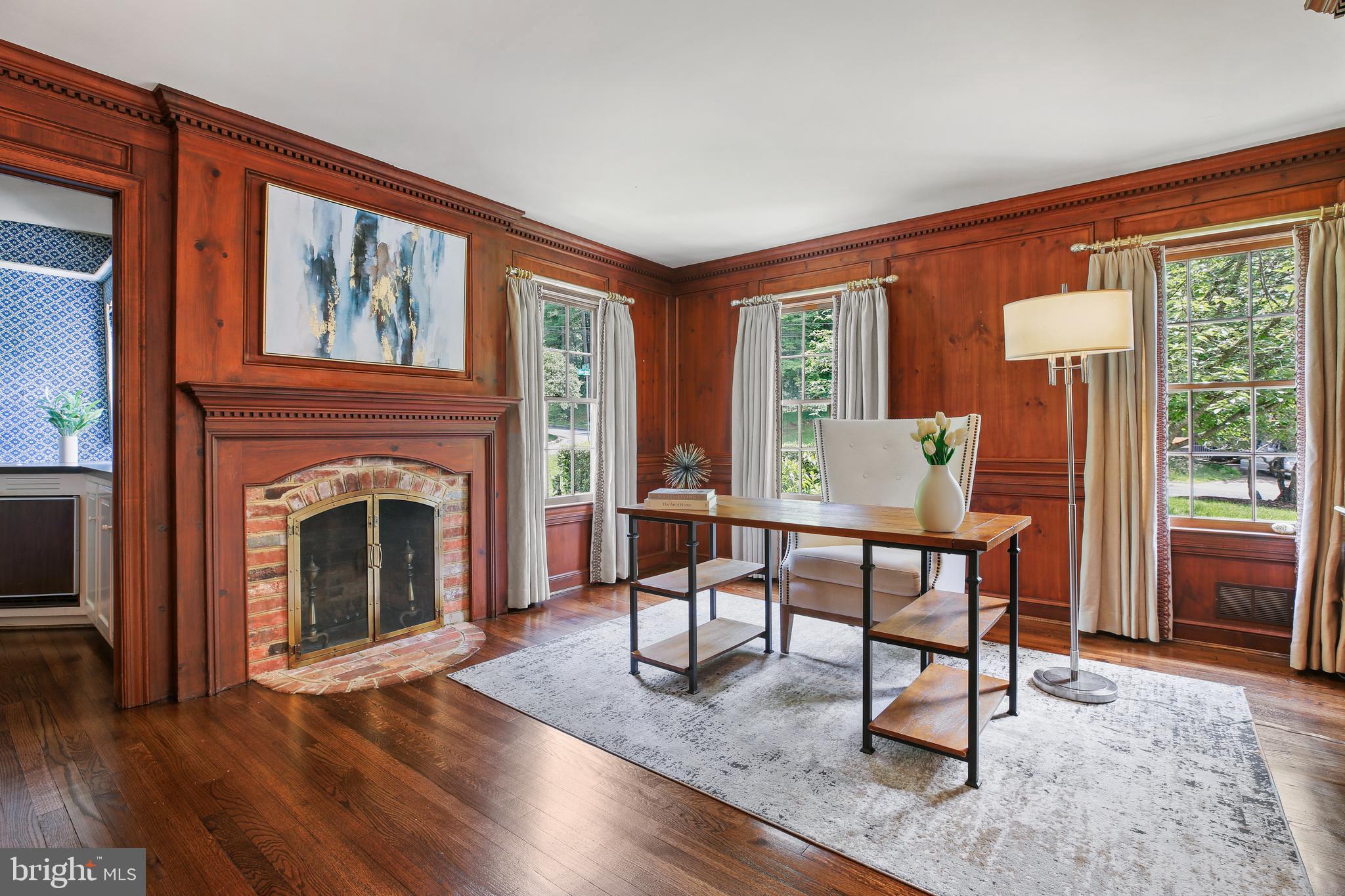 7125 Darby Road Bethesda, MD 20817 - Photo 27 of 64 a living room with furniture a fireplace and a table