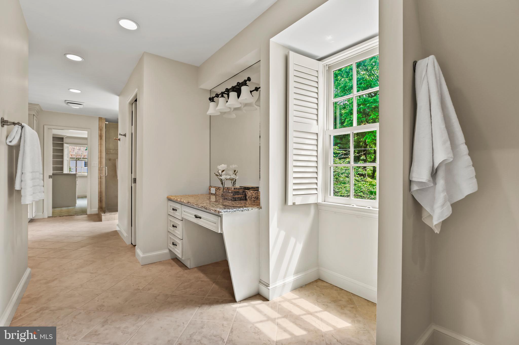 7125 Darby Road Bethesda, MD 20817 - Photo 38 of 64 a view of a hallway with furniture and a window