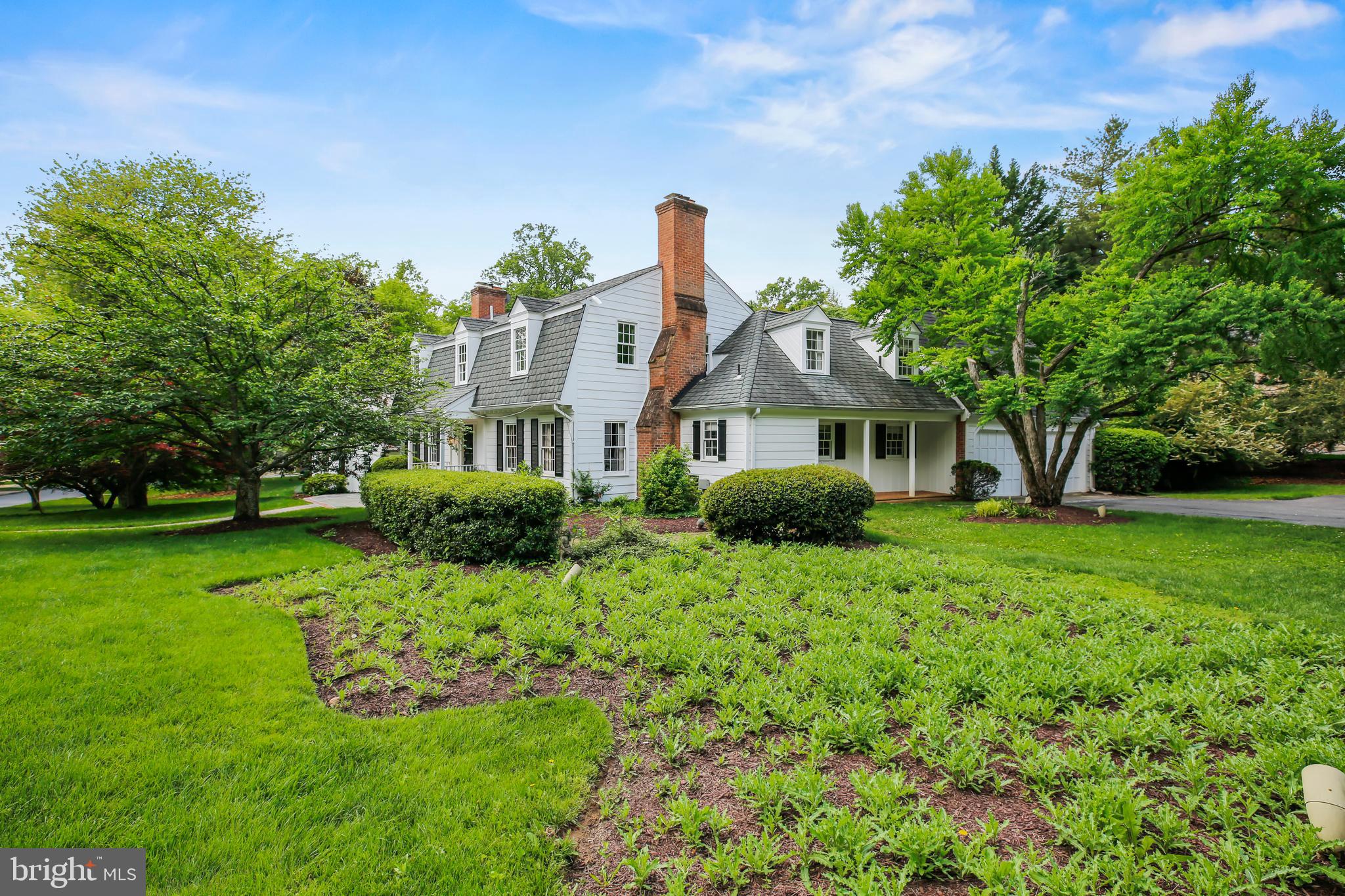 7125 Darby Road Bethesda, MD 20817 - Photo 4 of 64 a front view of a house with garden