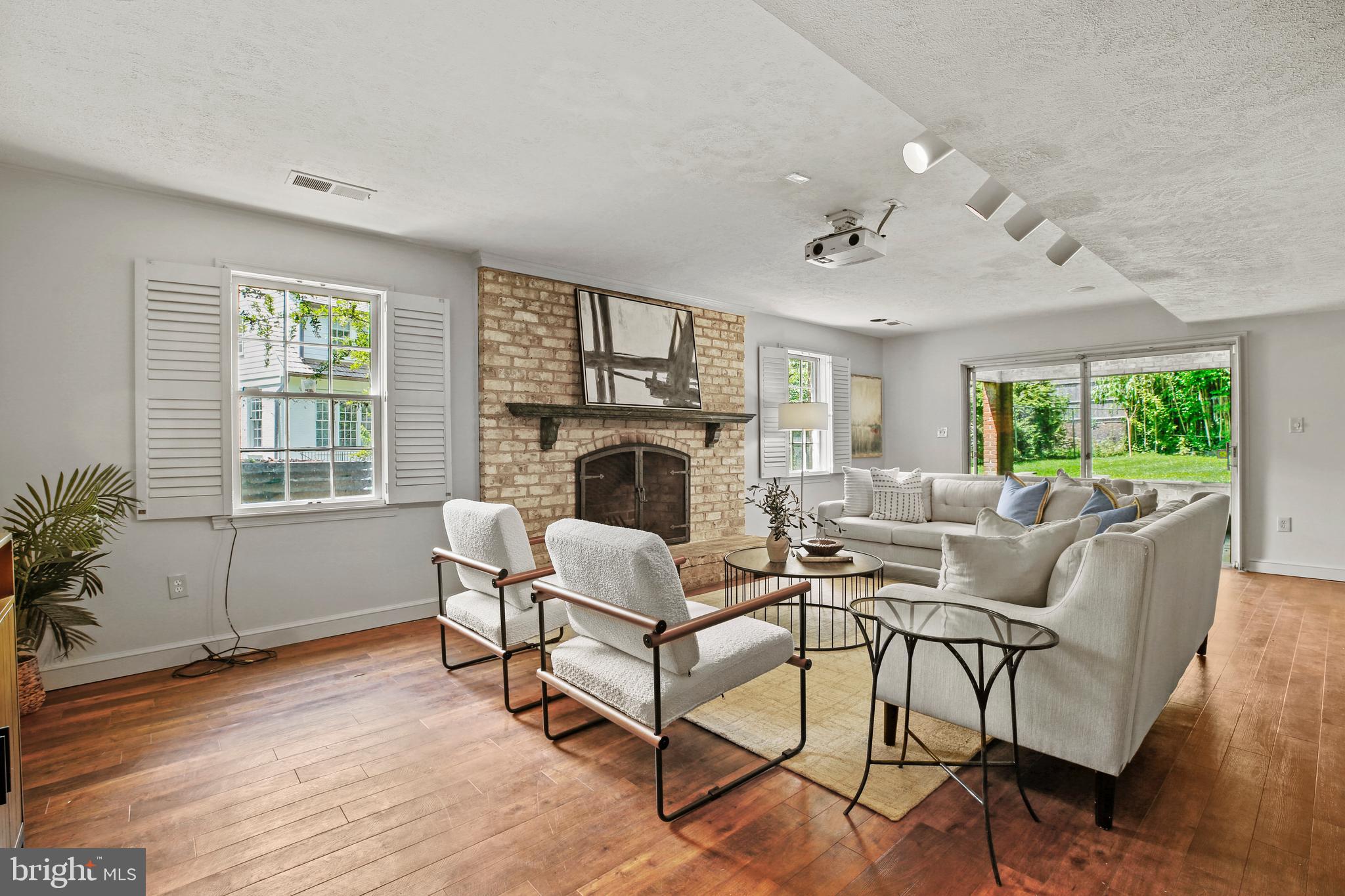 7125 Darby Road Bethesda, MD 20817 - Photo 51 of 64 a living room with furniture and a fireplace