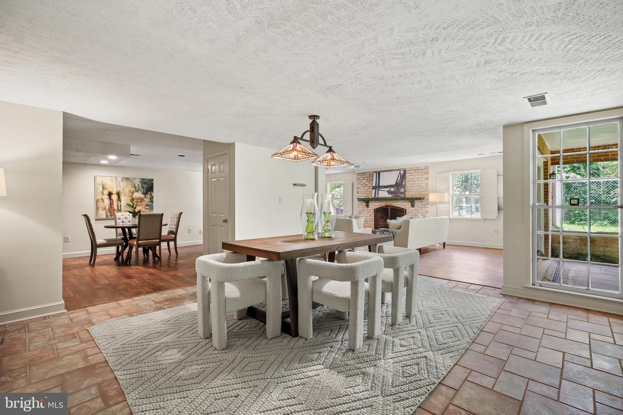 7125 Darby Road Bethesda, MD 20817 - Photo 53 of 64 a dining room with furniture a rug and a chandelier