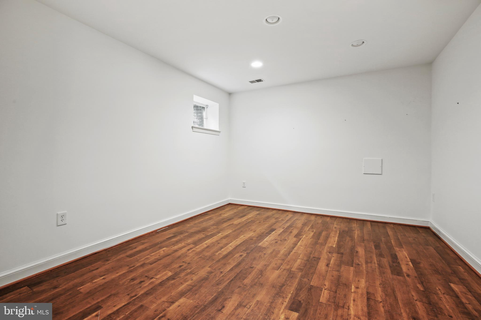 7125 Darby Road Bethesda, MD 20817 - Photo 57 of 64 a view of room with wooden floor and white walls