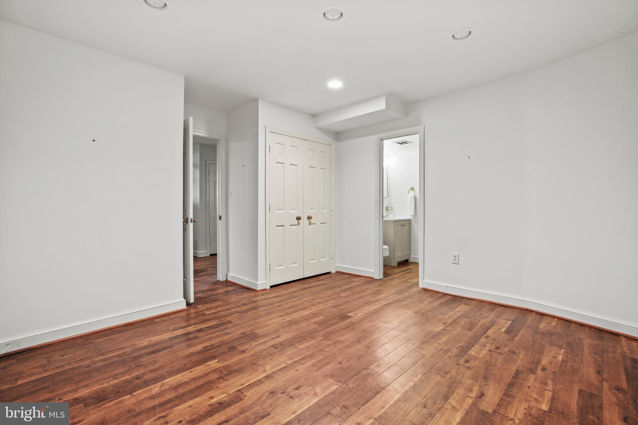 7125 Darby Road Bethesda, MD 20817 - Photo 58 of 64 a view of an empty room with wooden floor and window