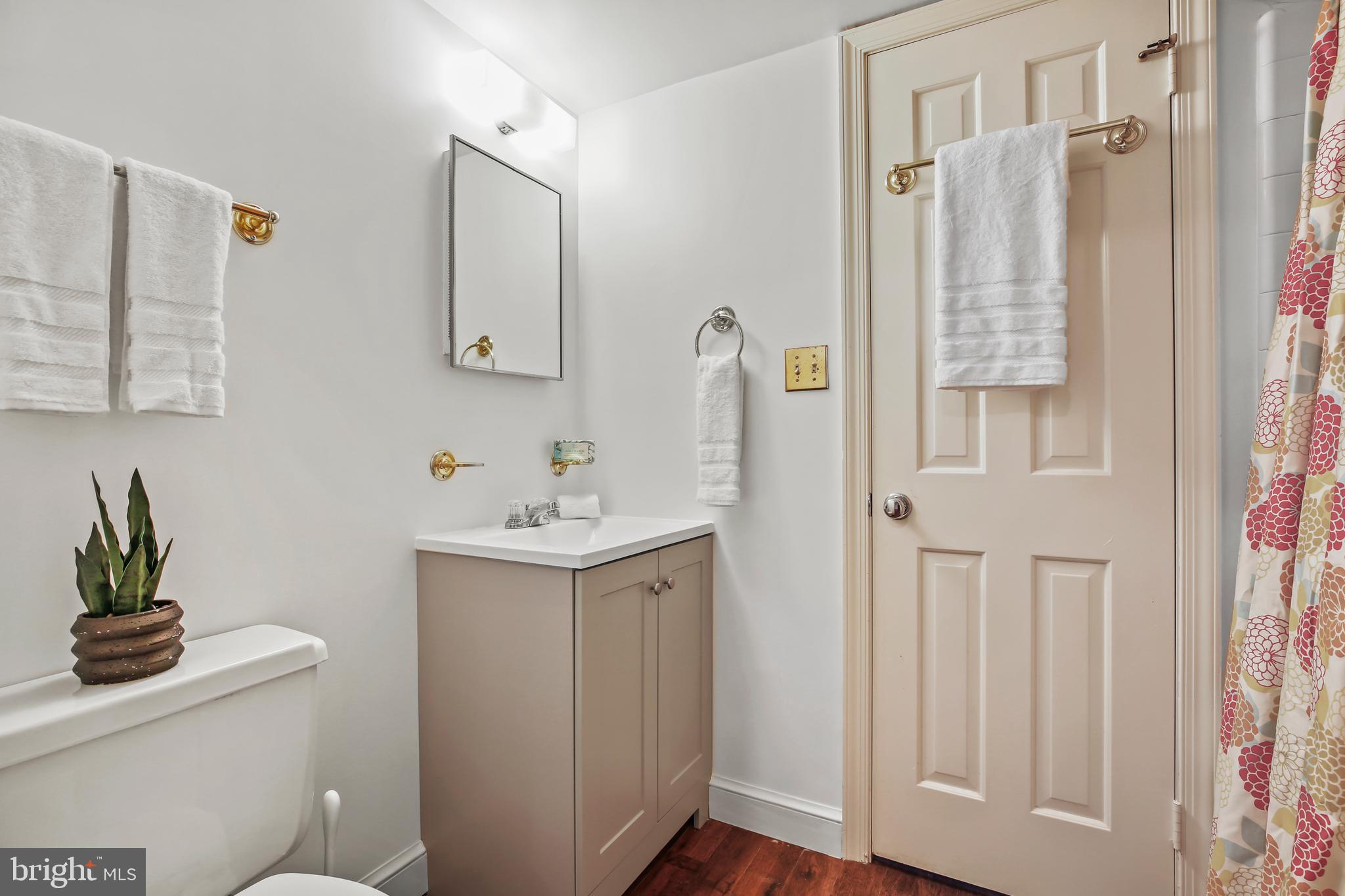 7125 Darby Road Bethesda, MD 20817 - Photo 59 of 64 a bathroom with a sink a toilet and shower