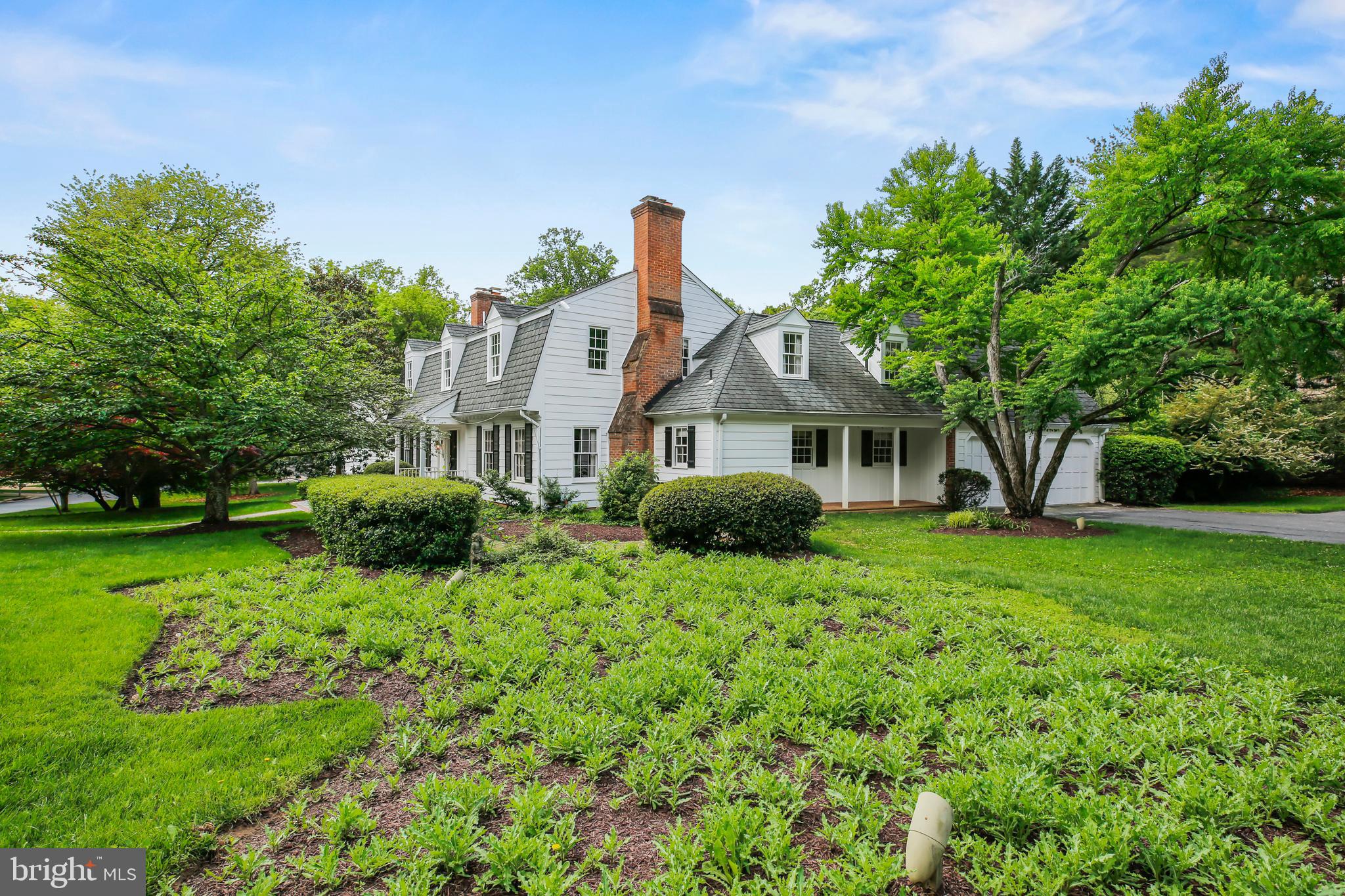 7125 Darby Road Bethesda, MD 20817 - Photo 63 of 64 a front view of a house with garden