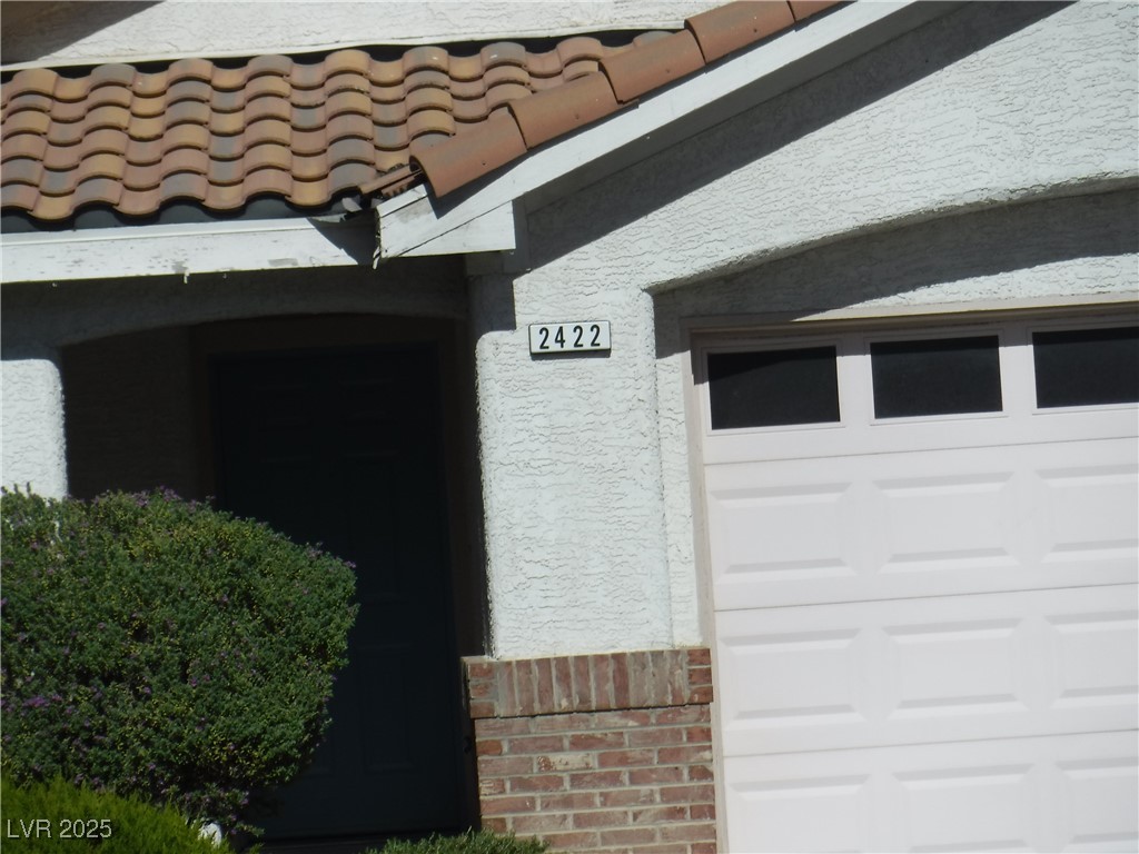 2422 Tottingham Road Henderson, NV 89074 - Photo 3 of 25 Exterior view of stucco siding