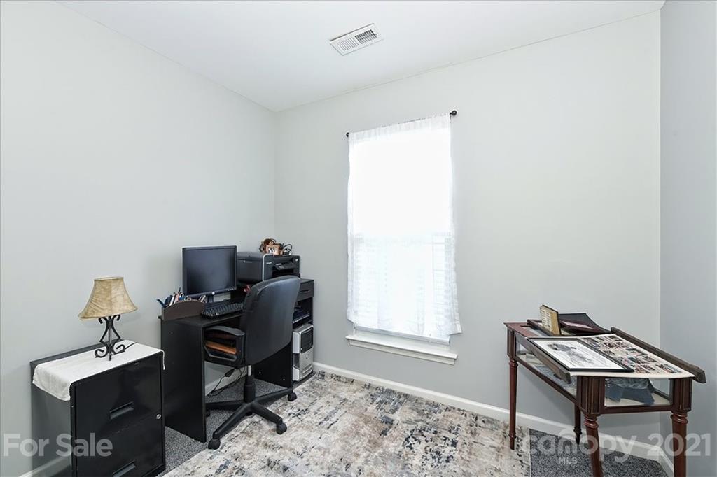 1262 Branson Road Northwest Concord, NC 28027 - Photo 19 of 34 a view of a workspace with furniture and a window