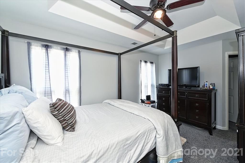 1262 Branson Road Northwest Concord, NC 28027 - Photo 20 of 34 a bedroom with a bed and a television