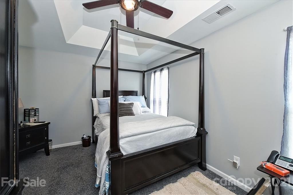 1262 Branson Road Northwest Concord, NC 28027 - Photo 21 of 34 a bedroom with a bed and a window