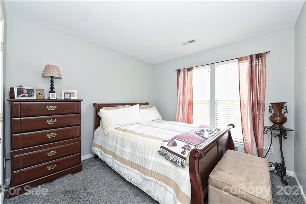 1262 Branson Road Northwest Concord, NC 28027 - Photo 24 of 34 a bed room with a bed and a chair