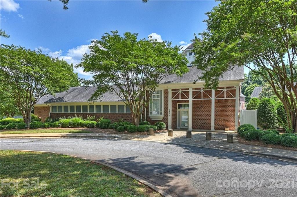 1262 Branson Road Northwest Concord, NC 28027 - Photo 31 of 34 a front view of a house with a yard and potted plants