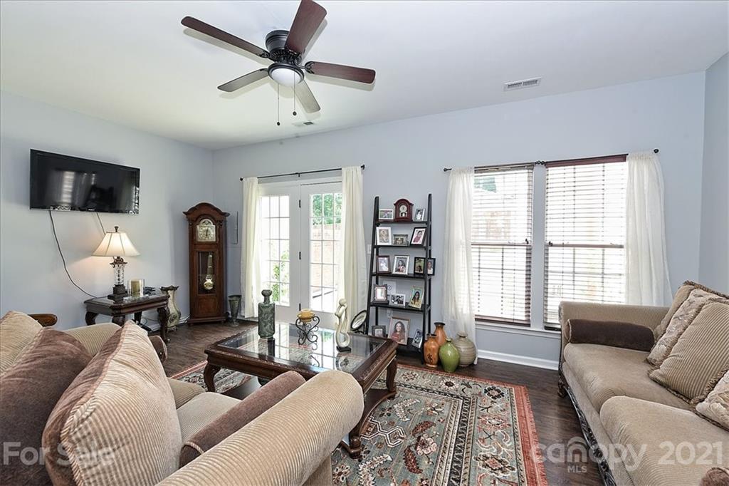 1262 Branson Road Northwest Concord, NC 28027 - Photo 5 of 34 a living room with furniture and a flat screen tv