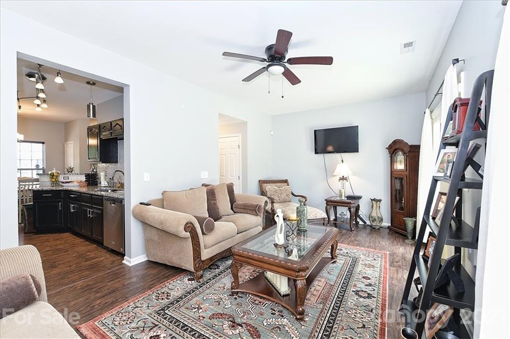 1262 Branson Road Northwest Concord, NC 28027 - Photo 7 of 34 a living room with furniture and a flat screen tv