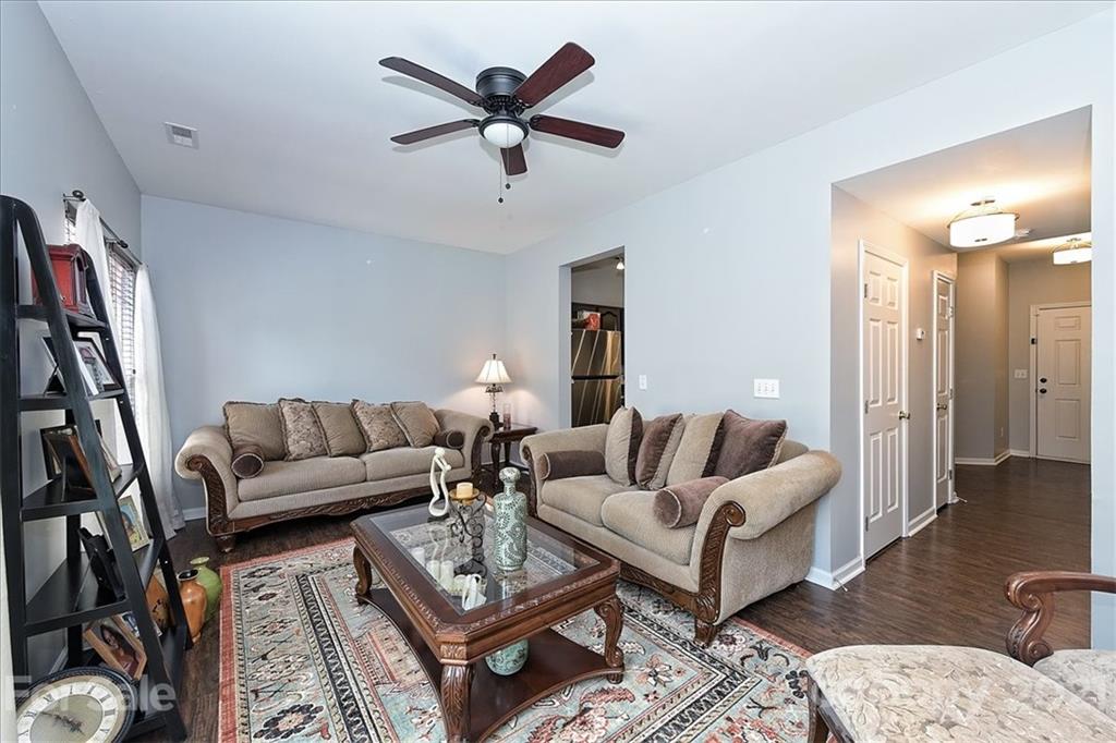 1262 Branson Road Northwest Concord, NC 28027 - Photo 9 of 34 a living room with furniture and a rug