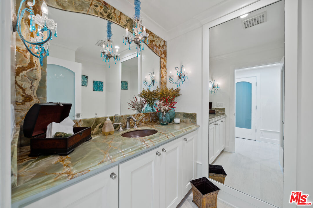 23318 Park Colombo Calabasas, CA 91302 - Photo 22 of 36 a bathroom with a sink and a mirror