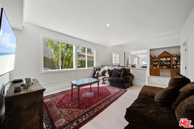 a living room with furniture or couch and a window