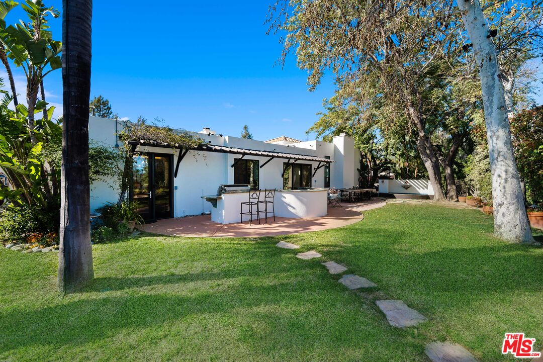 23318 Park Colombo Calabasas, CA 91302 - Photo 26 of 36 a view of a house with backyard and sitting area