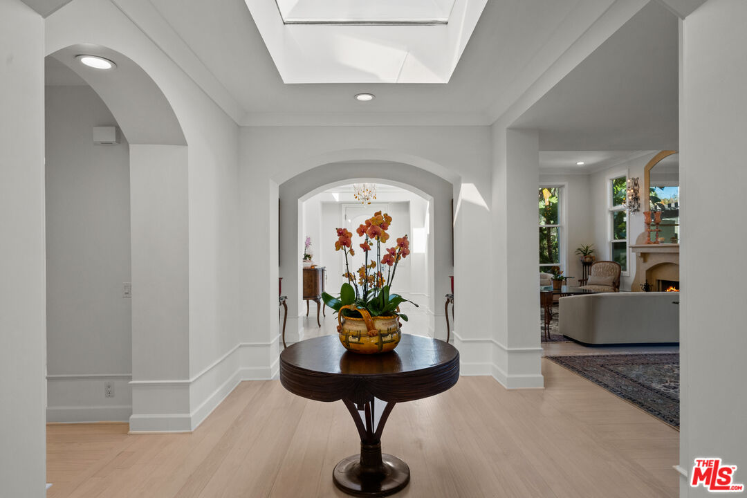 23318 Park Colombo Calabasas, CA 91302 - Photo 4 of 36 a living room with furniture and a chandelier