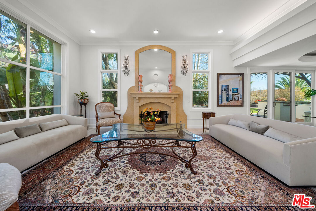 23318 Park Colombo Calabasas, CA 91302 - Photo 5 of 36 a living room with furniture and a fireplace