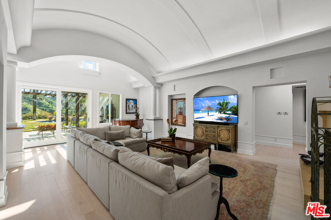 23318 Park Colombo Calabasas, CA 91302 - Photo 9 of 36 a living room with furniture and a flat screen tv