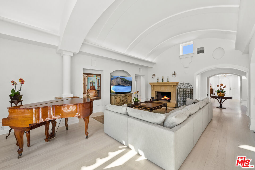23318 Park Colombo Calabasas, CA 91302 - Photo 10 of 36 a living room with fireplace furniture and a fireplace