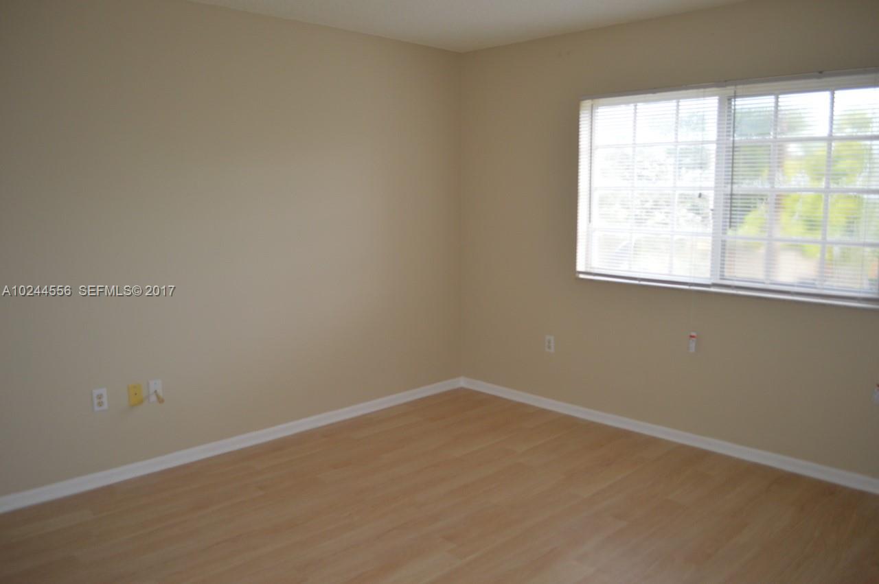 2011 Renaissance Boulevard, Unit 201 Miramar, FL 33025 - Photo 14 of 22 an empty room with a window