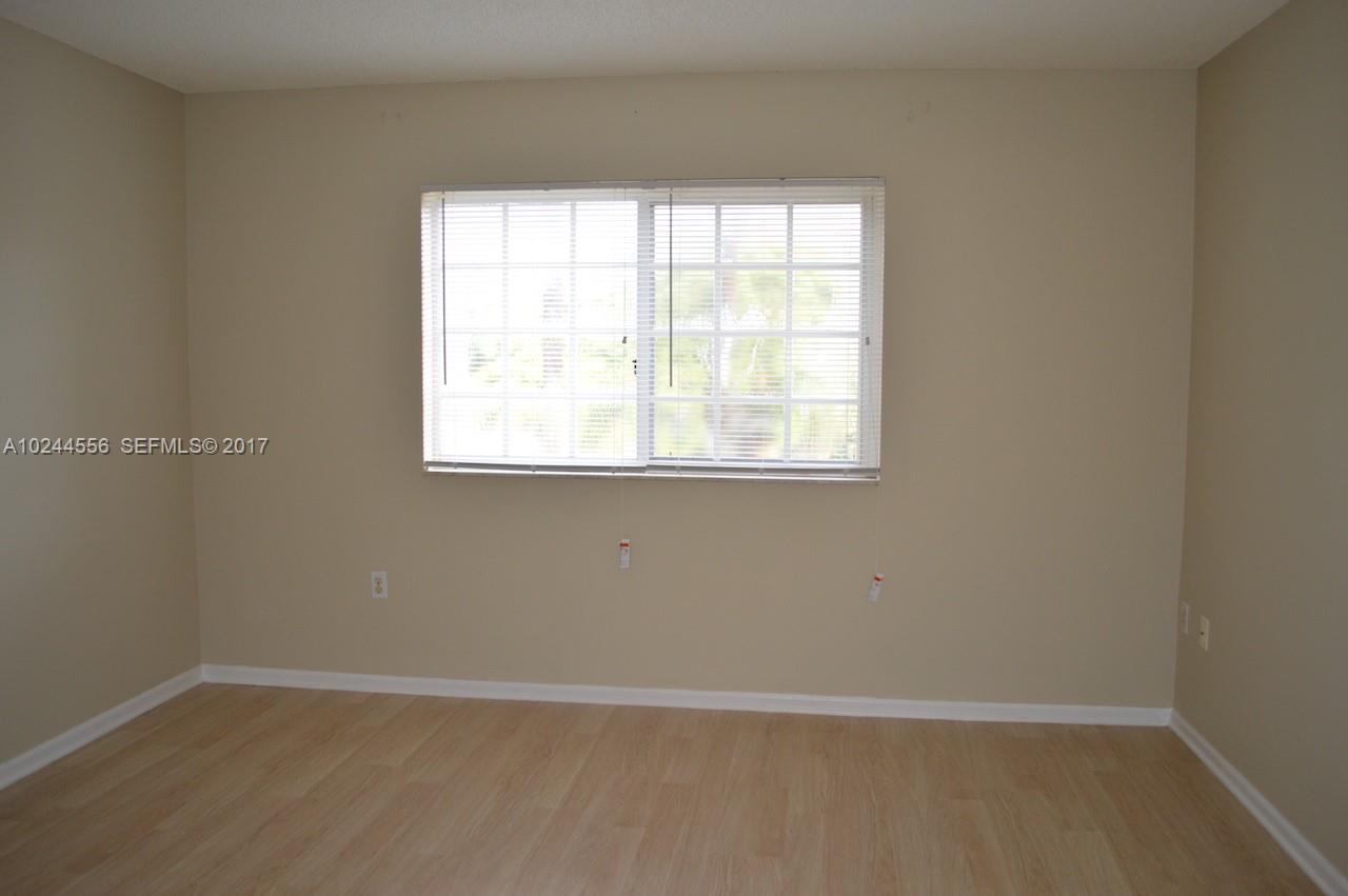 2011 Renaissance Boulevard, Unit 201 Miramar, FL 33025 - Photo 15 of 22 an empty room with a window