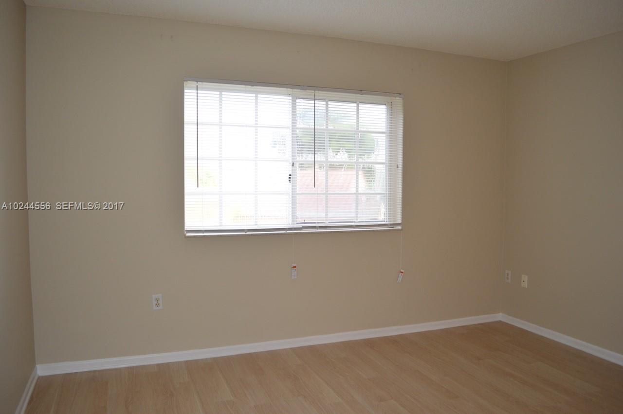 2011 Renaissance Boulevard, Unit 201 Miramar, FL 33025 - Photo 16 of 22 an empty room with a window