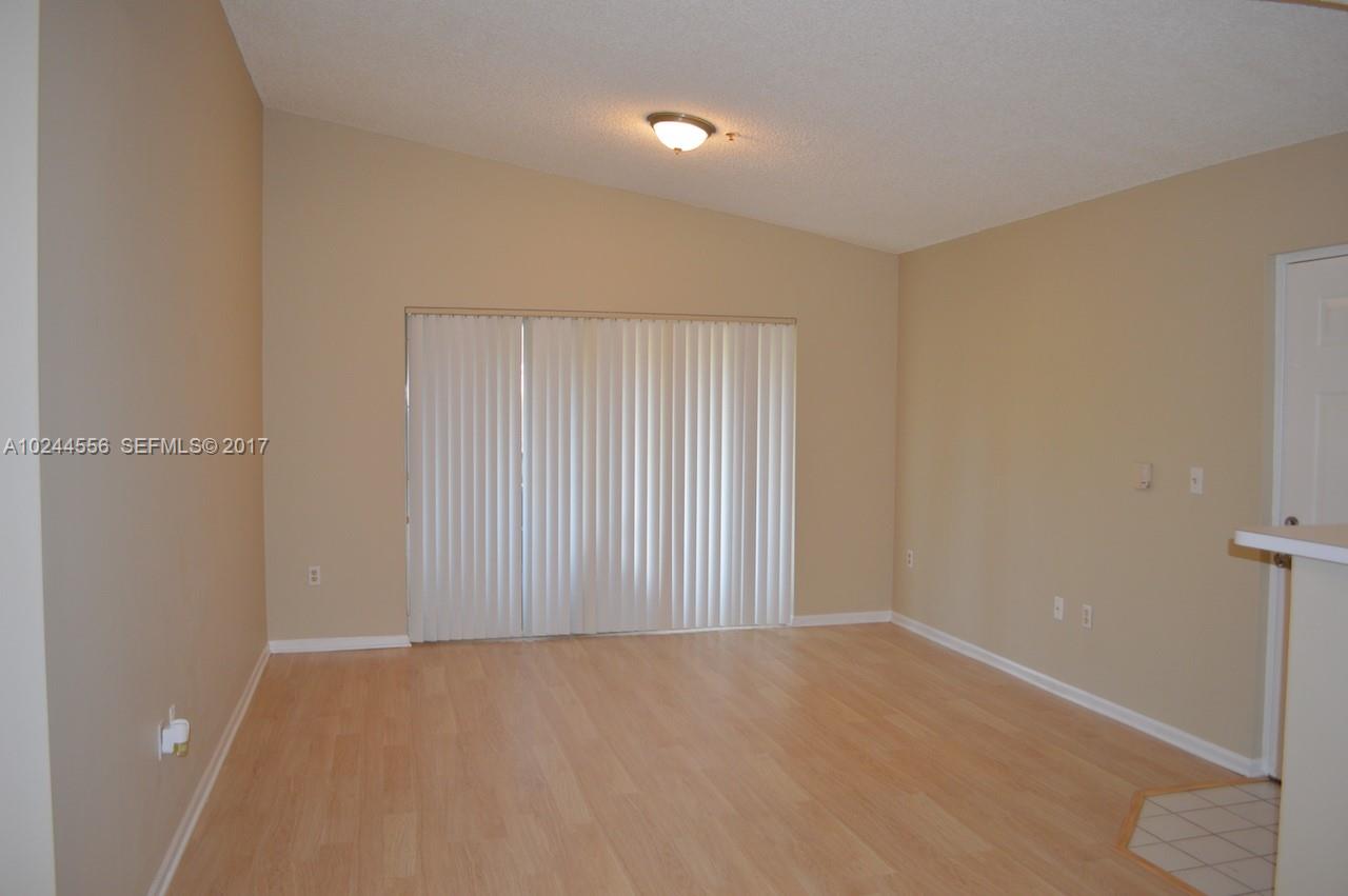2011 Renaissance Boulevard, Unit 201 Miramar, FL 33025 - Photo 3 of 22 a view of an empty room