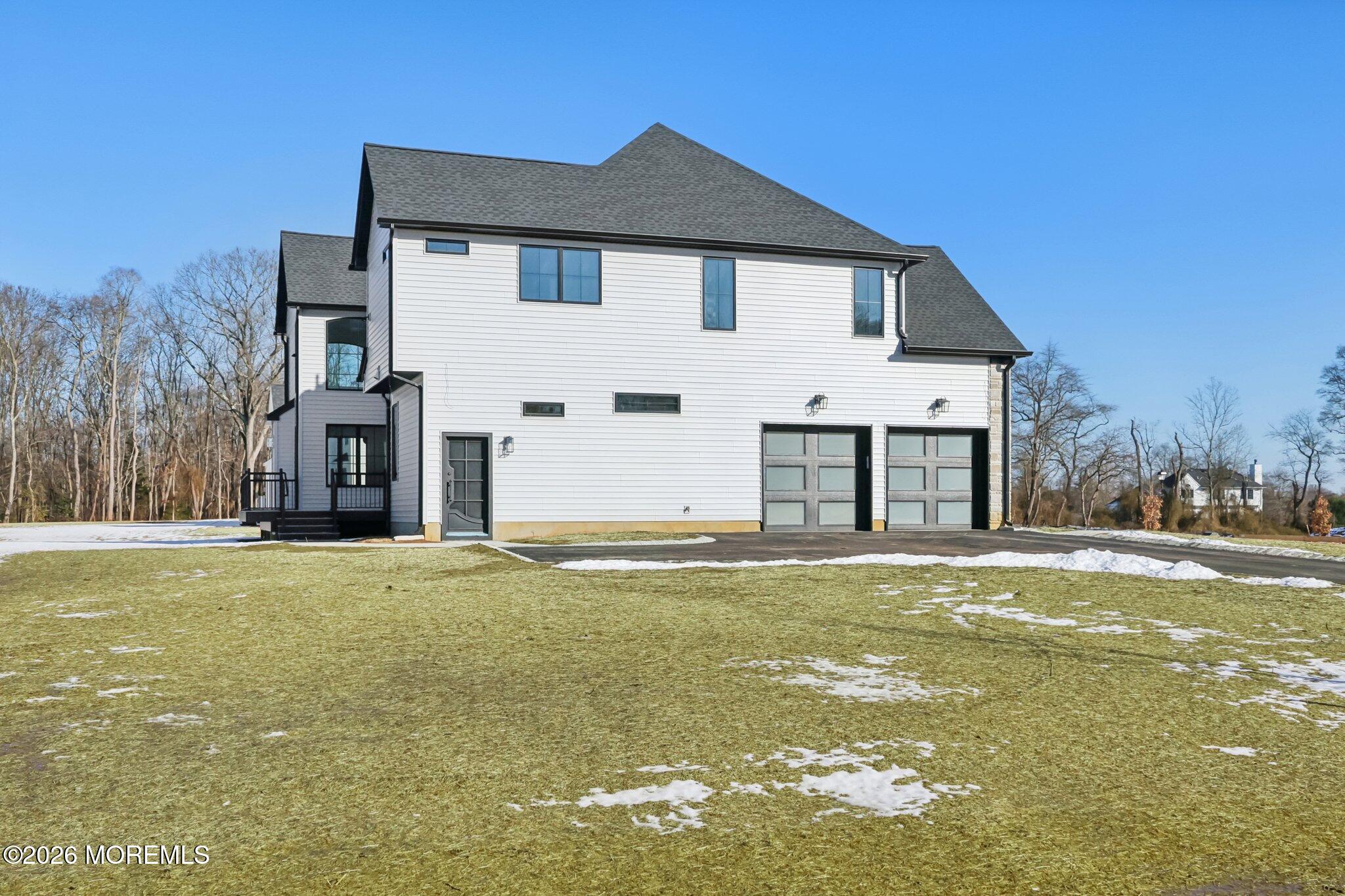 8 Hague Road Freehold, NJ 07728 - Photo 11 of 13 a front view of a house with a yard