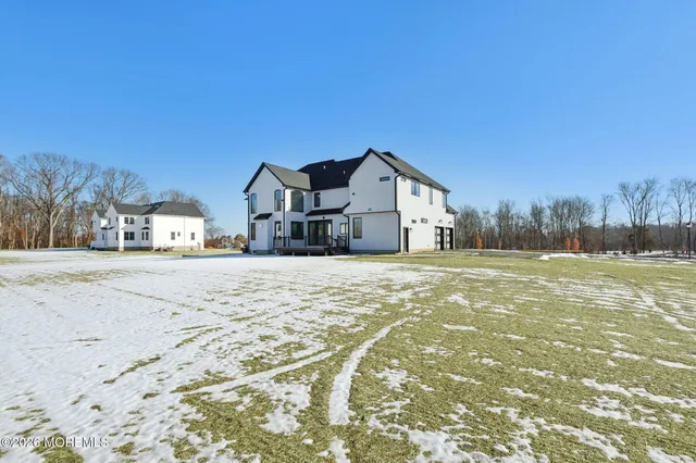 a view of house with a yard