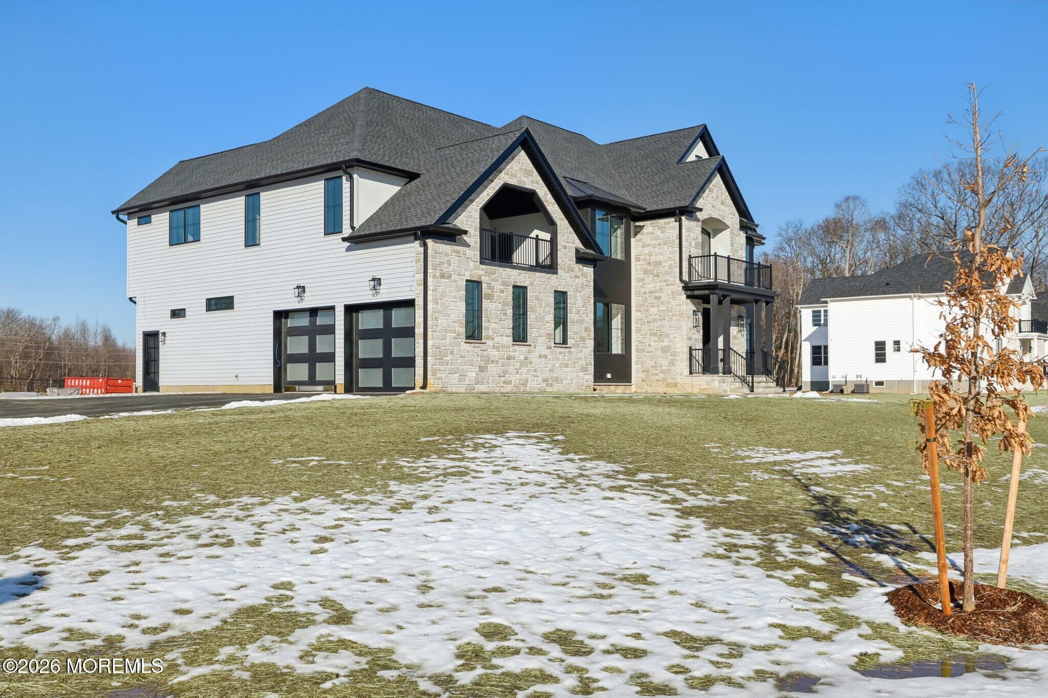 8 Hague Road Freehold, NJ 07728 - Photo 2 of 13 a front view of a house with a yard