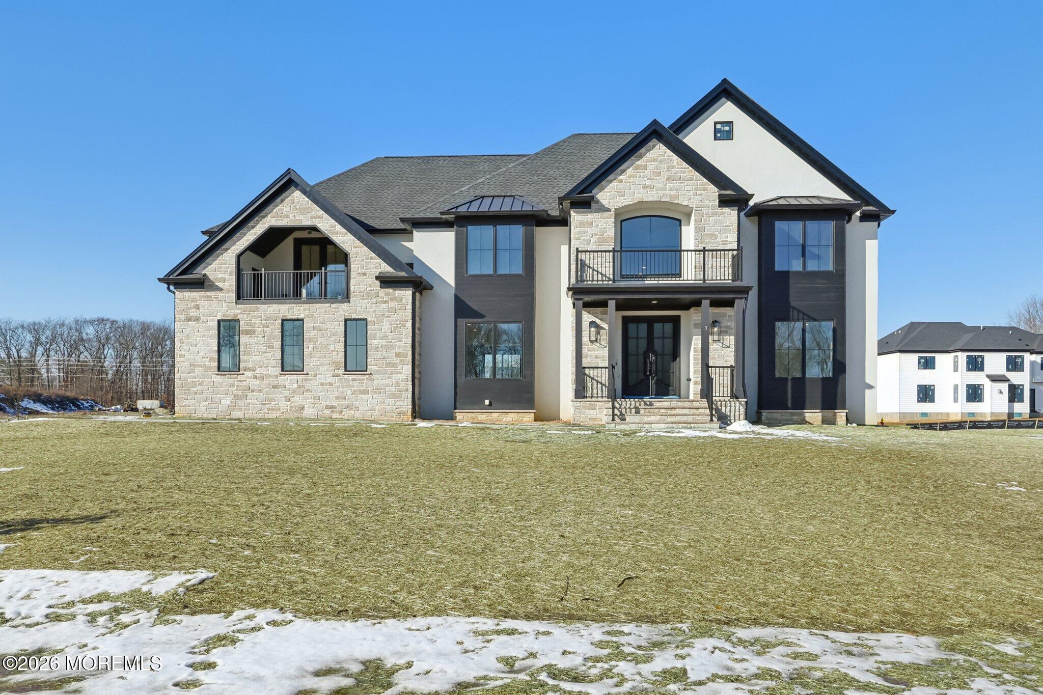 8 Hague Road Freehold, NJ 07728 - Photo 6 of 13 a front view of a house with a garden