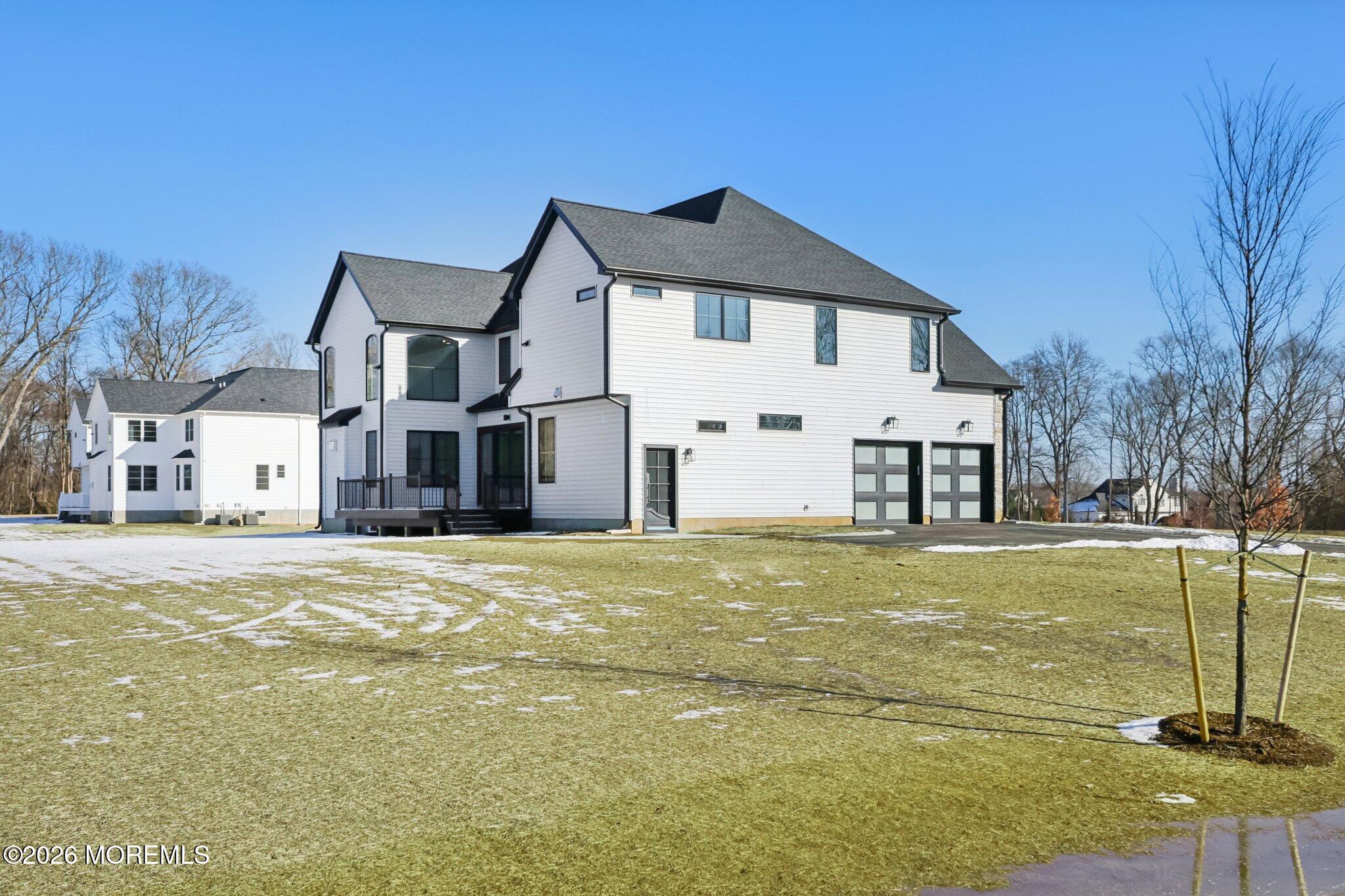 8 Hague Road Freehold, NJ 07728 - Photo 10 of 13 a front view of a house with a yard
