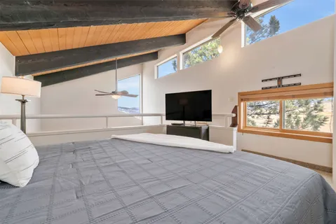 a view of a livingroom with furniture and a flat screen tv